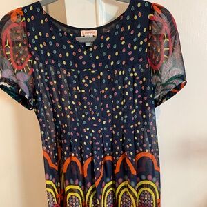 LUCCA blouse blue with multi-color design.